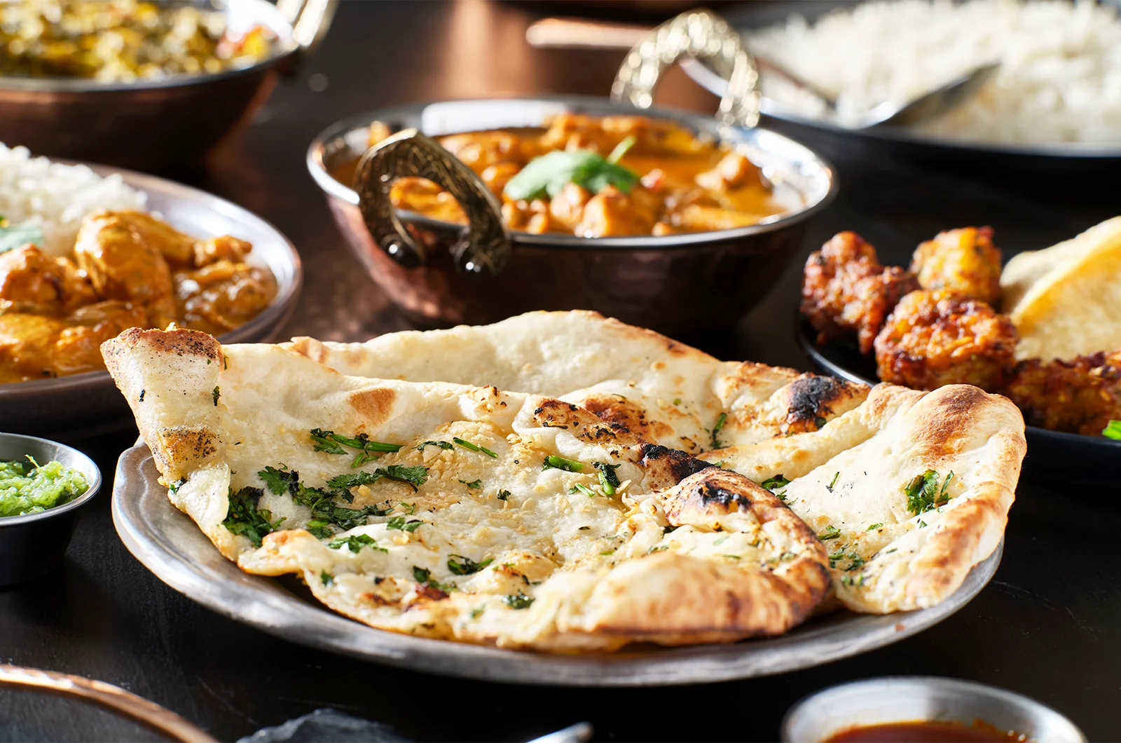 fluffy garlic naan with other side dishes